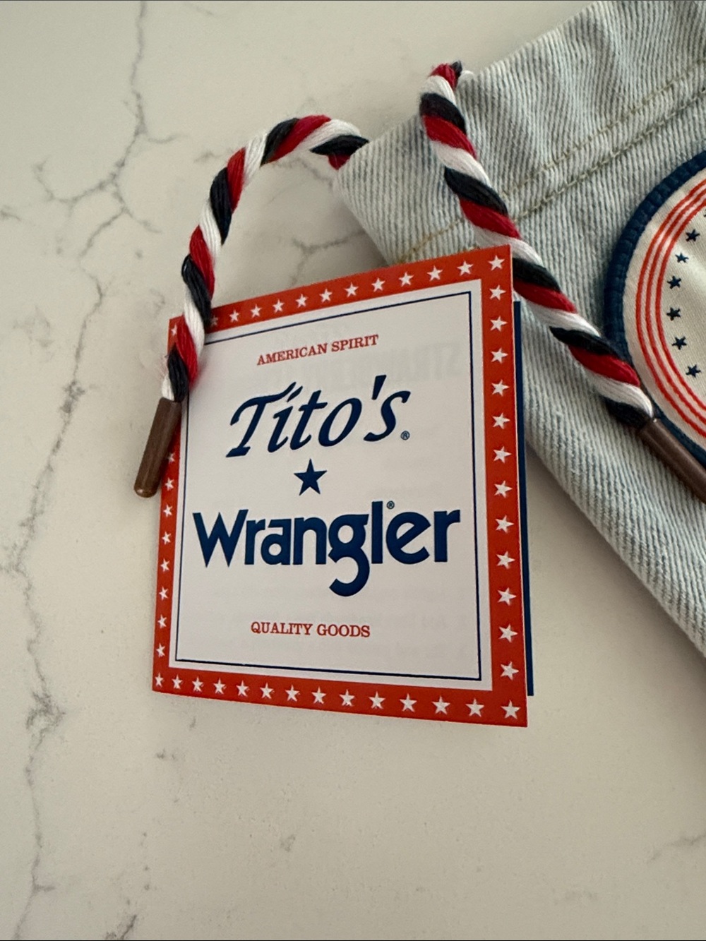Wrangler Light Denim Bottle Sleeve with Leather Patch and Red-White-Blue Cord - Picture 2 of 6